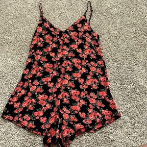 Red and black floral romper. Brand: Privacy Please. From Revolve